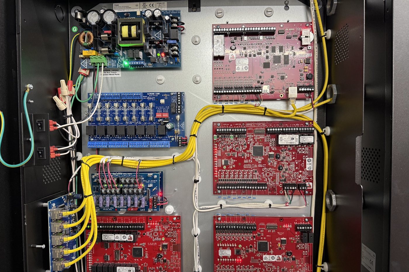 Access control enclosure with LenelS2 controller and reader interface boards on an Altronix power supply